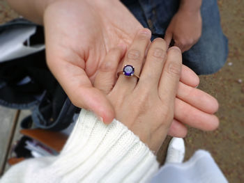 Close-up of people on hands