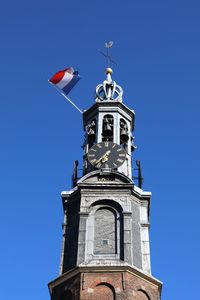 Low angle view of building against clear blue sky