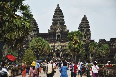 Group of people in temple against building