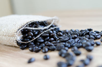 Close-up of roasted coffee beans on table