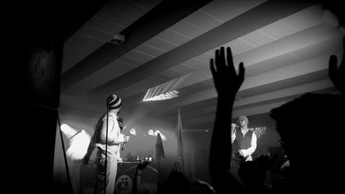 Silhouette of people at music concert