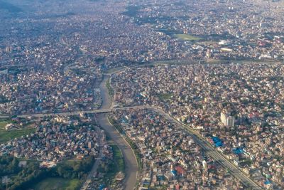 High angle view of crowd by buildings in city