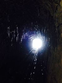 Low angle view of illuminated lights at night