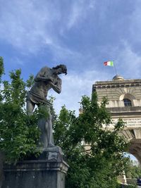 Low angle view of statue against sky