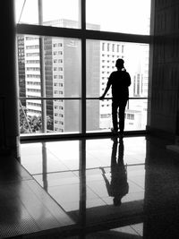 Woman standing in front of building