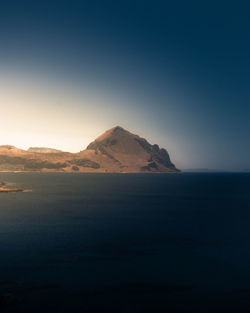 Scenic view of mountains against clear blue sky
