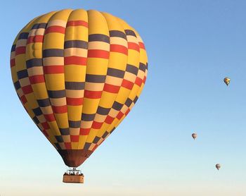 Low angle view of hot air balloons against sky