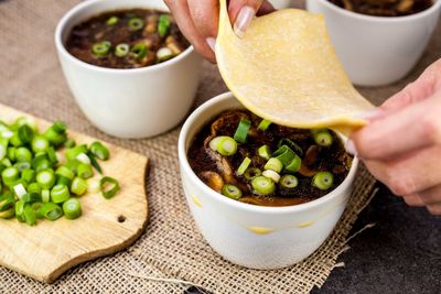 Close-up of hand preparing food