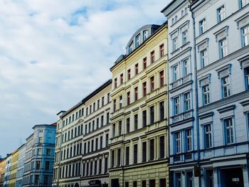 Low angle view of apartment buildings against sky