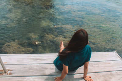 Sitting on the dock.