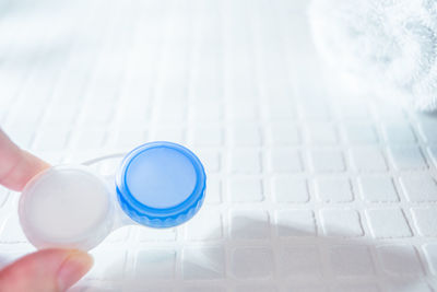 High angle view of person holding eyeglasses