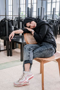 Young woman sitting on chair