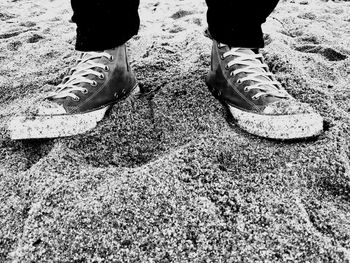 Low section of woman standing on tiled floor