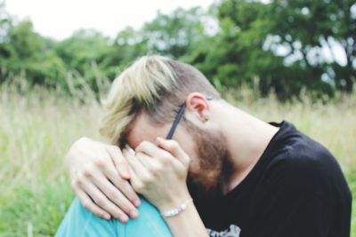 Woman standing on grassy field