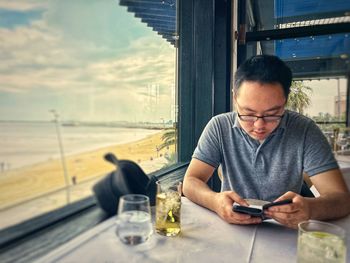 Young man using mobile phone