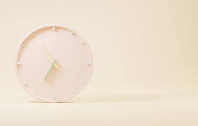 Close-up of clock against white background