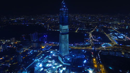 High angle view of illuminated buildings in city at night