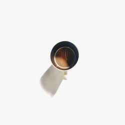 Close-up of lamp over white background