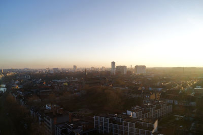 High angle view of buildings in city against clear sky