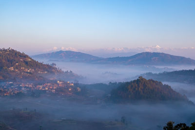 Scenic view of mountains against sky during sunset