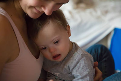 Close-up of mother and daughter at home