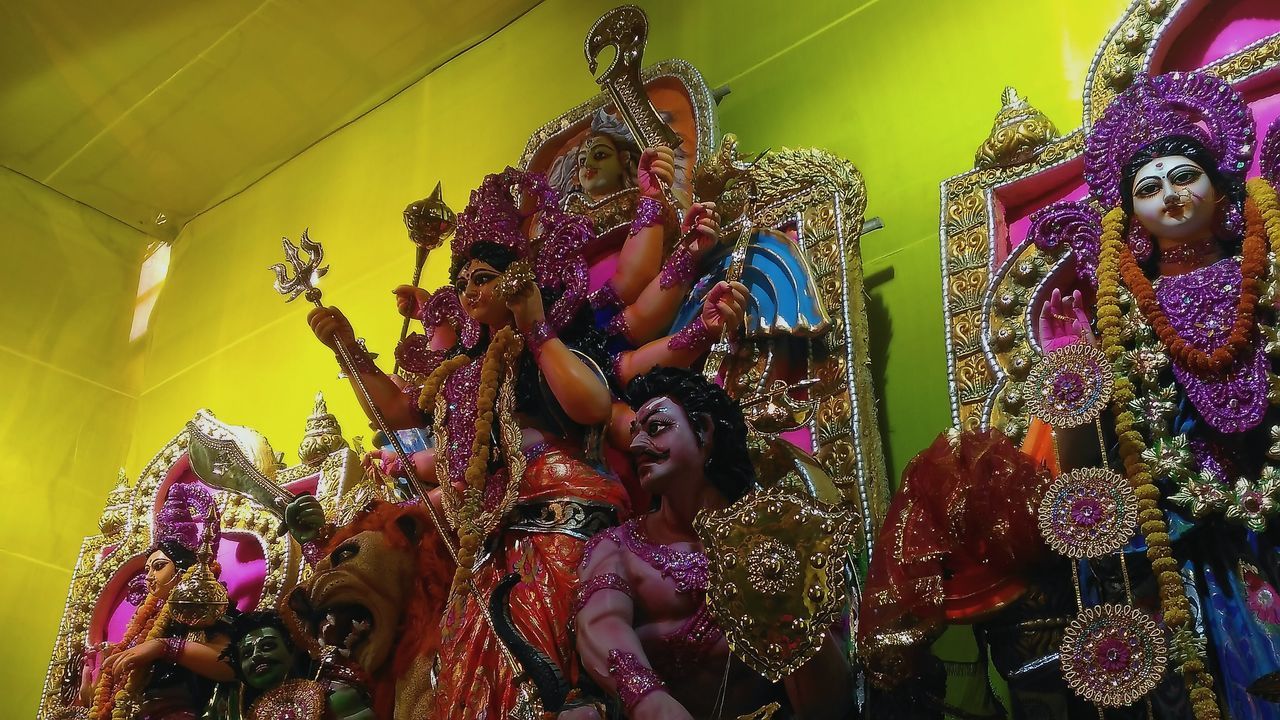 LOW ANGLE VIEW OF CHRISTMAS DECORATION HANGING ON DISPLAY