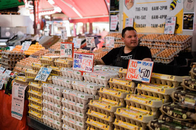 Portrait of man in store at market