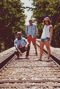 Full length of woman standing on railroad track