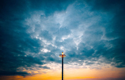 Low angle view of street light against sky