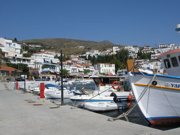 Buildings in town against clear sky