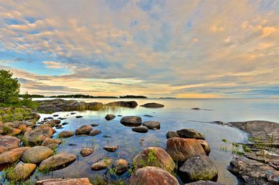 Scenic view of sea against sky at sunset