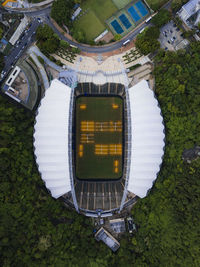 High angle view of building and trees in city