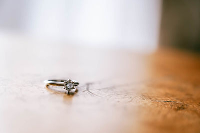 Close-up of wedding rings on table