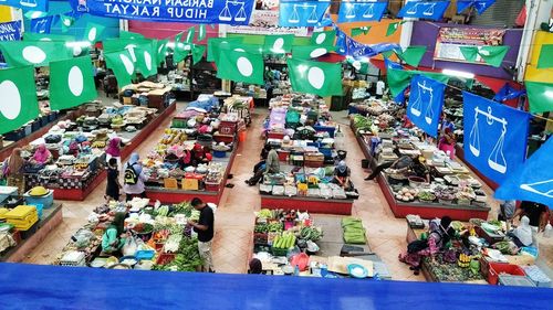 Group of people at market stall