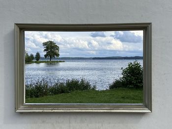 Scenic view of sea seen through window, schweriner see, lake schwerin, orangerie, frame for picture 