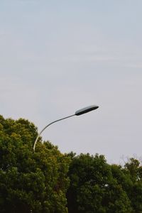 Low angle view of street light against sky