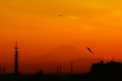 Scenic view of mt fuji against orange sky during sunset