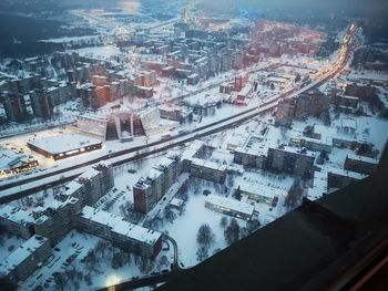 High angle view of buildings in city during winter