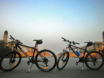 Bicycle parked against clear sky