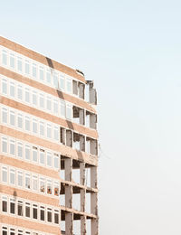 Low angle view of abandoned building against clear sky