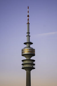 Low angle view of communications tower against sky