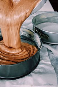 Close-up of batter pouring in container