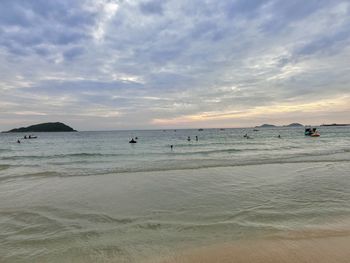 Scenic view of beach against sky during sunset