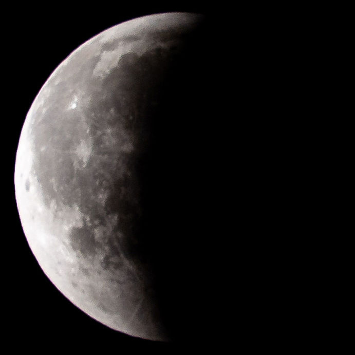 LOW ANGLE VIEW OF MOON IN SKY