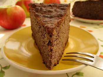 Slice of cake in plate on table