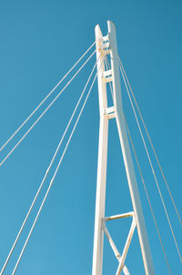 Low angle view of sailboat against clear blue sky