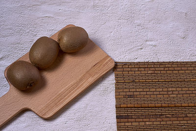 High angle view of bread on cutting board on table