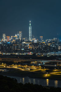 Illuminated buildings in city at night