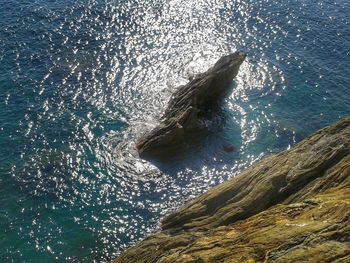 View of a rock at a rocky seashore 