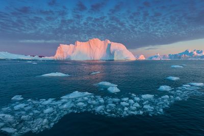 Scenic view of frozen sea against sky